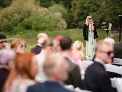 Professional wedding singer based in Surrey performing at an outdoor ceremony